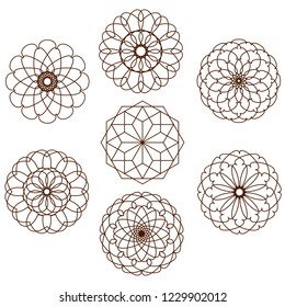 seven ornamental circular shapes on a white background