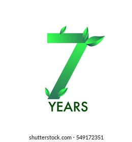 seven years anniversary celebration logotype with leaf and green colored. 7th birthday logo on white background