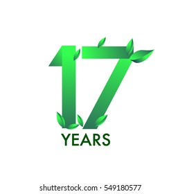 seventeen years anniversary celebration logotype with leaf and green colored. 17th birthday logo on white background