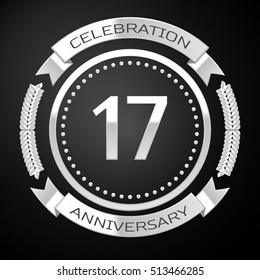 Seventeen years anniversary celebration with silver ring and ribbon on black background. Vector illustration