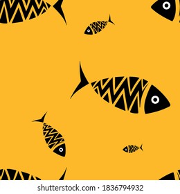 several black fish of different sizes on a mustard background for any type of printing