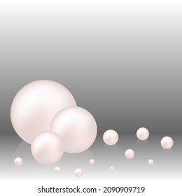 Several mother-of-pearls on a gray background. Abstract wind design. Background with pearls, decoration.