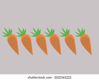 several orange carrots arranged in a row