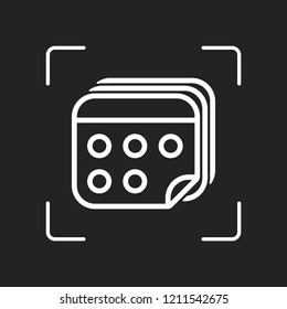 Several pages of calendar. Simple outline icon. White object in camera autofocus on dark background