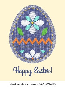 Sewing denim patch with stitch and fringe in Easter egg shape. Colorful flower embroidery on fabric. Happy Easter card.