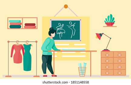 Sewing with designer working with pattern of cloth. Professional tailoring studio. Woman working on creating, hanger with clothes on the background. Planning of the future dress. Creative environment