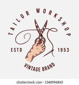 Sewing scissors. Tailor shop badges label. Tool and element for needlework. Handmade equipment. Engraved hand drawn realistic in old vintage sketch.