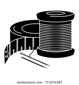 sewing thread tubes with needle and tape measure