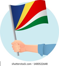 Seychelles flag in hand. Patriotic background. National flag of Seychelles vector illustration