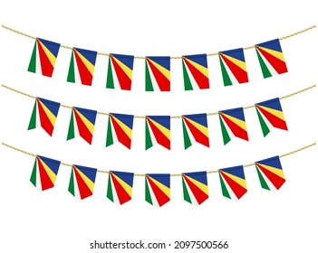 Seychelles flag on the ropes on white background. Set of Patriotic bunting flags. Bunting decoration of Seychelles flag