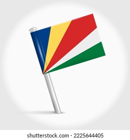 Seychelles map pin flag icon. Republic of Seychelles pennant map marker on a metal needle. 3D realistic vector illustration.