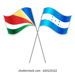 Seychellois and Honduran crossed flags. Seychelles combined with Honduras isolated on white. Language learning, international business or travel concept.