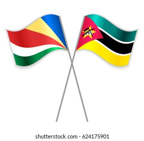 Seychellois and Mozambican crossed flags. Seychelles combined with Mozambique isolated on white. Language learning, international business or travel concept.