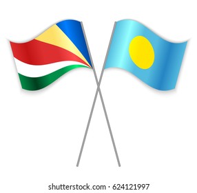 Seychellois and Palauan crossed flags. Seychelles combined with Palau isolated on white. Language learning, international business or travel concept.