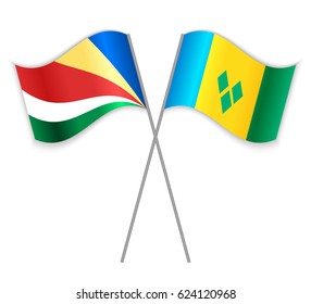 Seychellois and Vincentian crossed flags. Seychelles combined with Saint Vincent and the Grenadines isolated on white. Language learning, international business or travel concept.