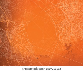 shabby orange wall covered with spooky spider web - halloween theme bright copy space background