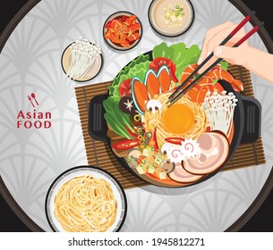 Shabu Shabu and Sukiyaki in hot pot at restaurant,  Hand holding chopsticks eating Shabu 