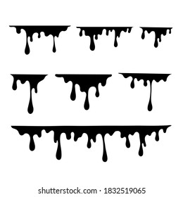 The shadow of the black ink droplets dripping onto the ground.