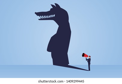 The shadow of a businessman holding a megaphone standing and shouting is a wolf