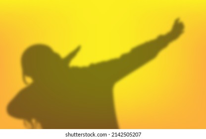 Shadow of a cute preteen girl is dancing and doing the dab dance move. The happy little girl is dabbing and laughing at the sound of trap music. Millennials and Gen Z.