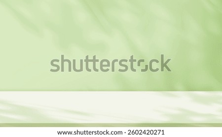 Shadow leave and blur gradient light on green studio background wall room and podium stage for product,Summer or Spring banner green pastel with abstract sunlight on floor texture