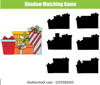 Shadow matching game. Kids activity with Christams giftboxes. New year holidays theme fun page for toddlers.