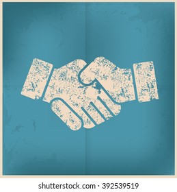 Shake hand design on old paper background,vector