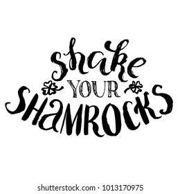 Shake your shamrocks lettering. St. Patrick's hand drawn quote. Brush paint strokes grunge phrase isolated on white background.
