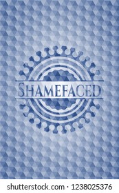 Shamefaced blue badge with geometric pattern.