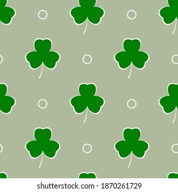 Shamrock y círculos sobre un fondo grisáceo. Ilustración vectorial de tréboles para el diseño superficial.