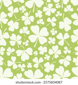 Shamrock or clover leaf flat design green seamless pattern falling leaves on white background vector illustration. Irish holiday celtic St Patrick day motif seamless pattern with shamrock clover leaf.