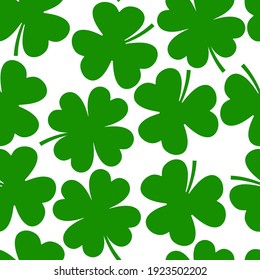 Shamrock, clover leaf vector cartoon seamless pattern on a white background.