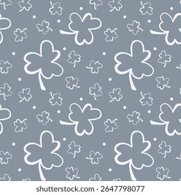 Shamrock Clover Leaves Repeating Pattern. Playful clover outlines and tiny dots on a cool gray base background wallpaper. Clean simple seamless pattern of scattered clovers and dots.