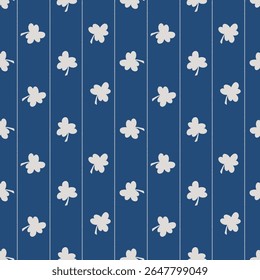 Shamrock Clover Seamless Pattern on Blue Stripes. White clovers scattered between dotted vertical lines on a deep blue canvas background wallpaper. Rows of white clovers vertical stripes.