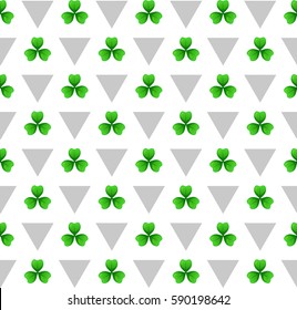 Shamrock, green lucky clover with three leaves. Sprig against white background with silver triangles. St Patricks Day geometry seamless pattern. Vector tileable design element.