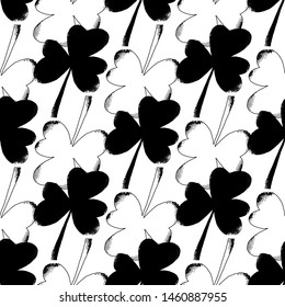 Shamrock leafs seamless pattern in black and white colors. Trendy vector illustration for fashion fabric, paper, wrapping, packaging, wallpaper, poster, cover, interior decor, all over print.