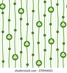 Shamrocks vector seamless pattern with endless wavy vertical stripes. St. Patrick Day background. Tiny, cute clover leaves endless texture with uneven bars.