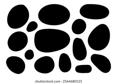 Shapes of black stones arranged artfully against a white background