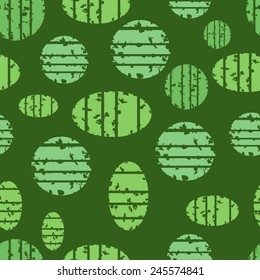 Shapes grunge seamless pattern on the green background for textile or print