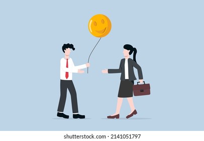 Sharing positive energy between workmates, making positive vibe in workplace, or giving happiness to release stress from work concept. Businessman giving happy face balloon to coworker.