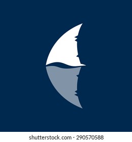 shark fin logo sign on dark blue background