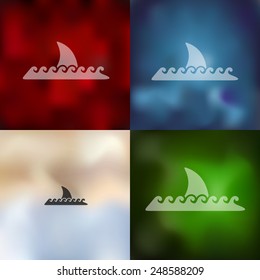 shark icon on blurred background