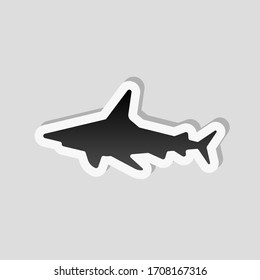 Shark silhouette, underwater predator. Sticker style with white border and simple shadow on gray background