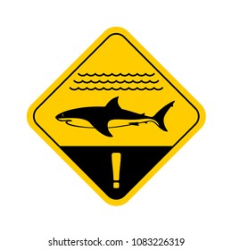 Shark warning sign with shark side view silhouette, sea waves surface and exclamation sign. Yellow rounded square traffic plate with danger swimming notice.