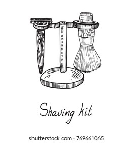 Shaving kit, razor and shaving brush with wooden holder, hand drawn doodle sketch with inscription, isolated vector illustration