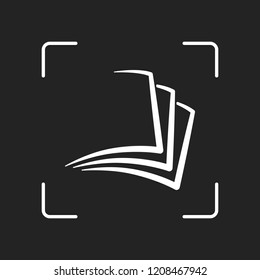 sheet of book, paper. White object in camera autofocus on dark background