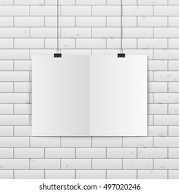 Sheet of folded paper hangs on the clamps. Vector EPS10 illustration.