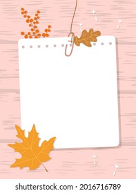  A sheet of notepad connected with a paperclip hang on a thread. Note paper, autumn oak and maple leaves, red berries on a wood texture background. Vector illustration, flat style.