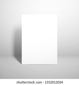 A sheet of paper or card is standing near the wall. Template for design with realistic shadows