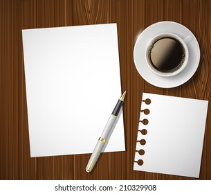 sheet of paper and a cup of coffee on a wooden table